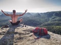 Naked man having picnic. Toples climber sit and eat sandwich