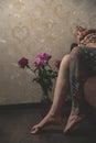 Tatoo girl on the sofa in home Royalty Free Stock Photo