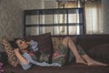 Tatoo girl on the sofa in home Royalty Free Stock Photo