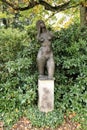 Naked torso of the naked girl on the pedestal