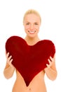 Naked woman with heart-shaped pillow Royalty Free Stock Photo