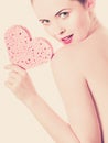 Naked woman holding heart shaped sponge Royalty Free Stock Photo