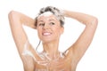 Naked woman shampooing her head. Royalty Free Stock Photo