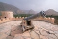 Nakhal,Oman - 04.01.2018: Canon in the yard inside of the medieval arabian fort of Nakhal, Oman. Fortification walls Royalty Free Stock Photo
