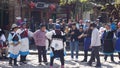 Nakhi women dance around the square in Lijiang Royalty Free Stock Photo