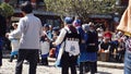 Nakhi women dance around the square in Lijiang Royalty Free Stock Photo