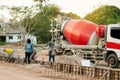 NAKHON PHANOM, THAILAND - DEC 24, 2018 : Concrete mixer truck. Workers are pouring concrete in site building construction Royalty Free Stock Photo