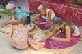 NAKHON PHANOM, THAILAND - Mar 25, 2019 : Group Senior Woman manually weaving bamboo