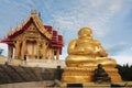 Golden Sitting Buddha Statue Katyayana at Wat Pa Phu Hai Long