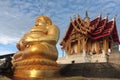 Golden Sitting Buddha Statue Katyayana at Wat Pa Phu Hai Long