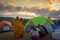 Nakhon Ratchasima,Thailand-December 31,2017:Morning sunrise,people come to relax on holiday,give alms to the monks,to make merit,