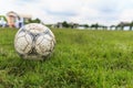 Nakhon Ratchasima, Thailand - October 1 : Muddy soccer ball on a football field in Municipal Stadium Nakhon Ratchasima on October Royalty Free Stock Photo