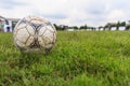 Nakhon Ratchasima, Thailand - October 1 : Muddy soccer ball on a football field in Municipal Stadium Nakhon Ratchasima on October Royalty Free Stock Photo