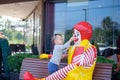 Happy cute little Asian toddler baby boy child play with Ronald McDonald