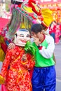 NAKHON SAWAN, THAILAND - FEBRUARY 8 : unidentified asian man whispering the one in mask in Chinese New Year festival on February 8