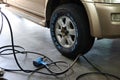 Nakhon Sawan, Thailand, June 21, 2021. The mechanic is fixing car wheels, changing tires, checking the brake system, suspension.