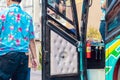 Nakhon Si Thammarat ,THAILAND-AUGUST 30,2020 : Blue alcohol gel bottle hanging on the door of the double-decker bus to serve