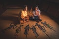 Nakhon Si Thammarat, Thailand - August 15, 2020: Senior women and Granddaughter play shadow puppet is traditional South of