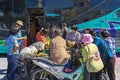 NAKHON SI THAMMARAT-THAILAND,AUGUST 30, 2000 : An unidentified elderly female vendor ride a motorcycle selling durians and fruits