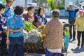 NAKHON SI THAMMARAT-THAILAND,AUGUST 30, 2000 : An unidentified elderly female vendor ride a motorcycle selling durians and fruits