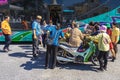 NAKHON SI THAMMARAT-THAILAND,AUGUST 30, 2000 : An unidentified elderly female vendor ride a motorcycle selling durians and fruits