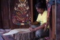 Man making leather puppet for Thai traditional shadow puppet