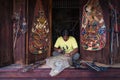 Man making leather puppet for Thai traditional shadow puppet