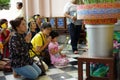 Nakhonphatom, Thailand:September 19, 2016 - Portrait of grandmother and granddaughter praying the Buddhist at the temple with