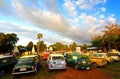 December 16, 2017: Many old Classic Mini Austin cooper parked on grass field with green tree and blue sky background Royalty Free Stock Photo