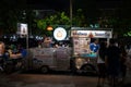 Nakorn Prathom, Thailand - April 4, 2023 : Local people walking in food truck night market in front of Phra Pathom Chedi the