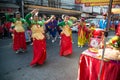 Teen Chinese Fairy of gods doing ritual at Ancestor worship table in Chinese New Year Celebrations in Thailand.