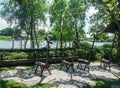 Nakornpathom / Thailand - August 12 2020: creative craft wooden chairs at riverside in Tree & Tide cafe
