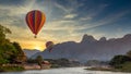 Nam Song river at sunset with hot air balloon in Vang Vieng, Laos, Beautifull landscape on the Nam Song River in Vang Vieng, Laos Royalty Free Stock Photo