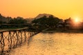 Nam Song River with wooden bridge at sunset in Vang Vieng, Laos Royalty Free Stock Photo