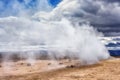 Namafjall Hverir geothermal area in Iceland. Stunning landscape of sulfur valley with smoking fumaroles and blue cloudy sky Royalty Free Stock Photo