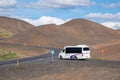 Tourist bus in Namaskard mountain pass in North Iceland