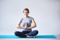 Namaste. Beautiful young woman in sportswear practicing yoga. Royalty Free Stock Photo