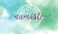 Namaste lettering on white mandala and watercolor texture background