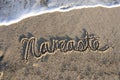 Namaste written in the sand Royalty Free Stock Photo