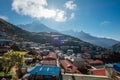 Namche Bazaar settlement on Everest Base Camp EBC trekking route and snowy Thamserku 6608m mountain on the background. Royalty Free Stock Photo