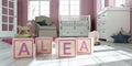 The name alea written with wooden toy cubes in children`s room