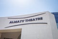 The name of the Almaty Theater on the facade of the modern Almaty Theater