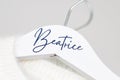 The name beatrice on a white coat hanger