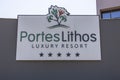 Name billboard on facade of Portes Lithos hotel. Europe. Greece.