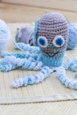 Name:Crocheted woven with colored wool toy octopus close-up Royalty Free Stock Photo