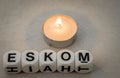 The term Eskom and a small candle Royalty Free Stock Photo