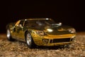 Reproduction of a toy GT40 ford on a sand background