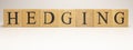 The name Hedging was created from wooden letter cubes. Economics and finance.