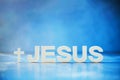 Name JESUS made with cement letters on blue light marble background. Copy space. Biblical, spiritual or christian