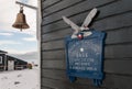 Name plaque and bell on living building, Gonzalez Videla Base, Antarctic Peninsula